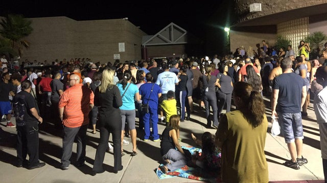 Parents wait outside Walter Johnson Junior High School in Las Vegas while the school was locked down because a student brought mercury to the school on Sept. 7, 2016. 
