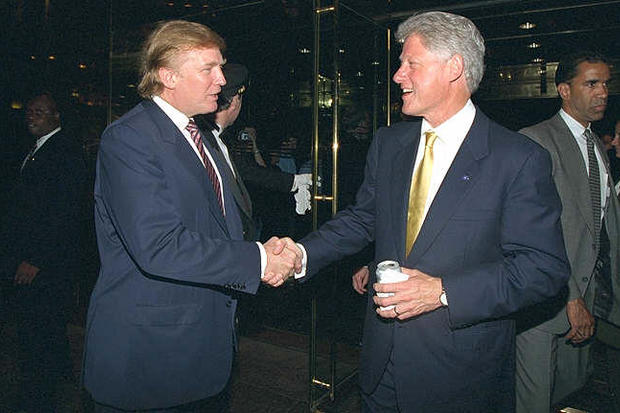 Donald Trump and President Clinton shake hands at a fundraiser at Trump Tower in New York on June 16, 2000. 