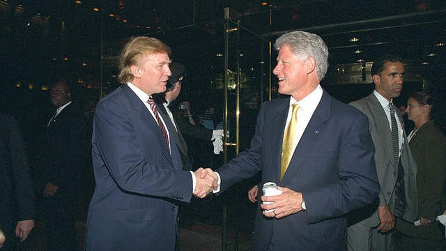Donald Trump and President Clinton shake hands at a fundraiser at Trump Tower in New York on June 16, 2000. 