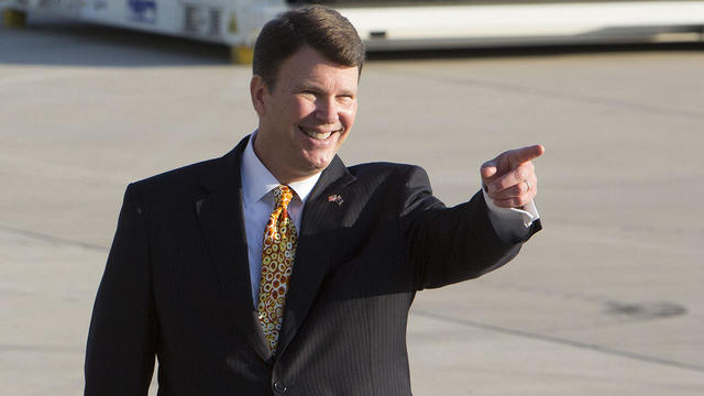 U.S. Ambassador to Australia John Berry waits on the tarmac at Amberley RAAF Base for the arrival of President Obama to Australia 