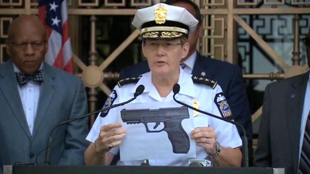 Police Chief Kim Jacobs holds a picture of the type of replica weapon held by 13-year-old Tyre King when he was gunned down by a police officer in Columbus, Ohio, on Sept. 14, 2016. 