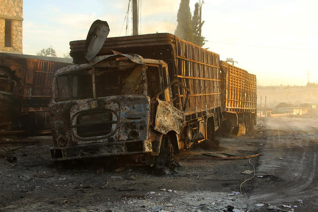 Damaged aid trucks are pictured after an airstrike on the rebel held Urm al-Kubra town, western Aleppo city, Syria 