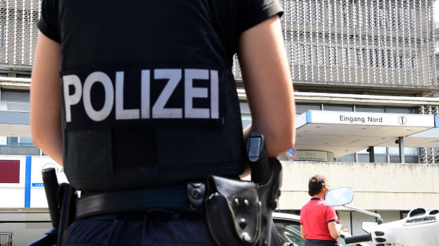 A policewoman stands in front of a hospital following a shooting on July 26, 2016, in southwestern Berlin. 