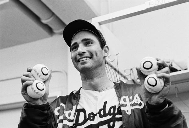 Sandy Koufax Holding 4 "Zero" Baseballs 