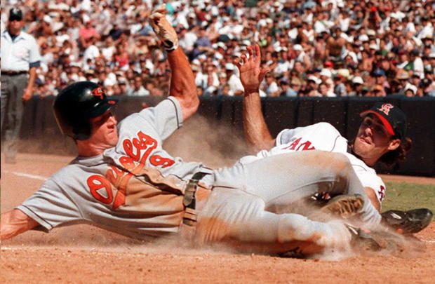 Brady Anderson of the Baltimore Orioles slides saf 