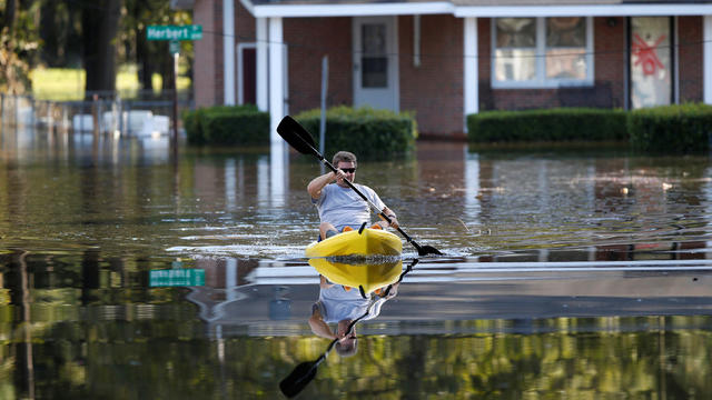 Parker Uzzell checks on his property with a kayak after the effects from Hurricane Matthew in Goldsboro, North Carolina, Oct. 12, 2016. 