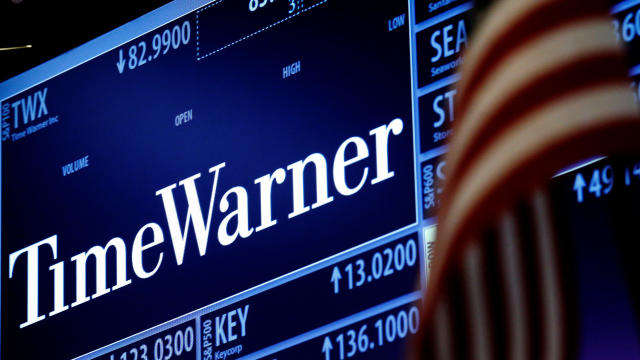Ticker and trading information for media conglomerate Time Warner Inc. is displayed at the post where it is traded on the floor of the New York Stock Exchange in New York City Oct. 21, 2016. 