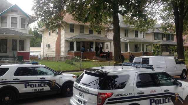 Crews work the scene after a 7-year-old allegedly fatally shot a 3-year-old in Toledo, Ohio. 