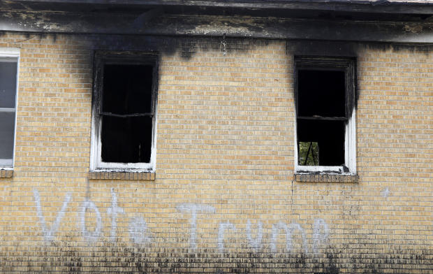“Vote Trump” is spray-painted on the side of the fire-damaged Hopewell M.B. Baptist Church in Greenville, Miss., Nov. 2, 2016. 
