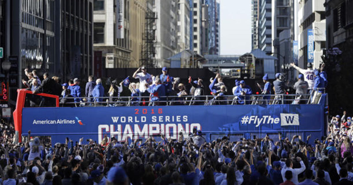 Chicago Cubs' Ben Zobrist holds the World Series MVP Trophy as he arrives  on stage during the 2016 World Series Champion celebration rally at the  Grant Park on November 4, 2016 in