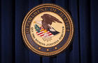The Department of Justice logo is pictured on a wall after a news conference in New York Dec. 5, 2013. 