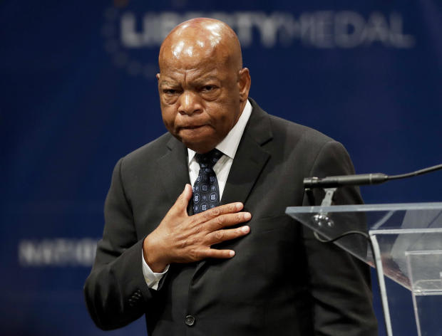 In this Sept. 19, 2016, file photo, Rep. John Lewis, D-Georgia, reacts after being presented with the Liberty Medal for his dedication to civil rights during a ceremony in Philadelphia. 