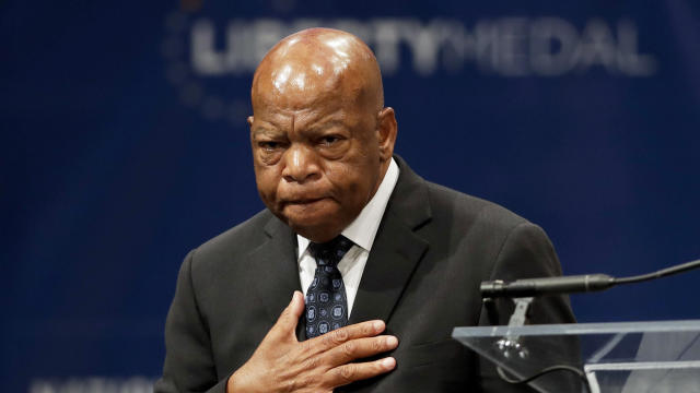 In this Sept. 19, 2016, file photo, Rep. John Lewis, D-Georgia, reacts after being presented with the Liberty Medal for his dedication to civil rights during a ceremony in Philadelphia. 