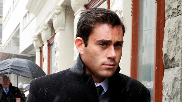 Jake Nolan walking to court in the rain 