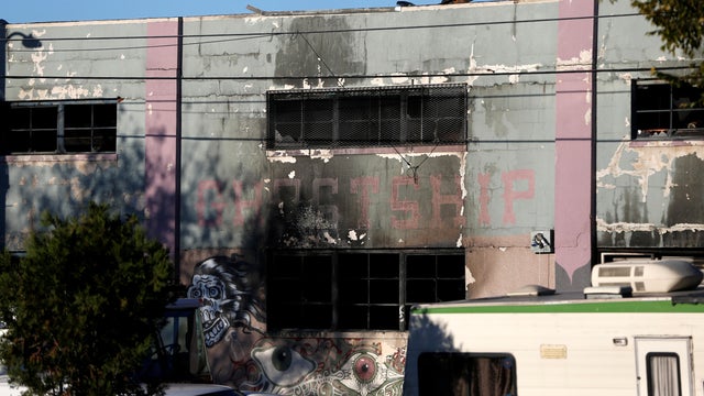 A charred wall is seen outside a warehouse after a fire broke out during an electronic dance party, resulting in at least nine deaths and many unaccounted for in the Fruitvale district of Oakland, California, Dec. 3, 2016. 