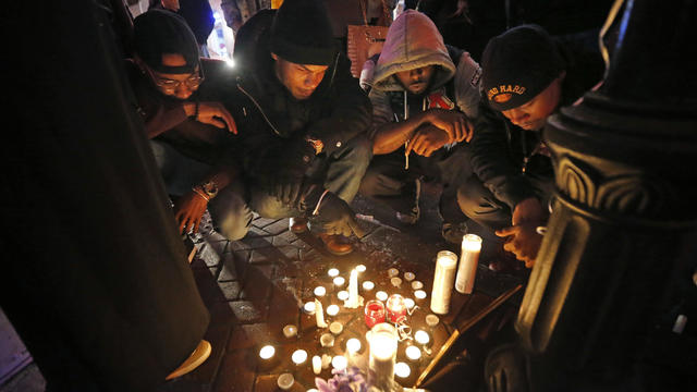 Friends and relatives of Demontris Toliver participate in a vigil at Bourbon Street and Iberville Street for Toliver, who was killed in a shooting in the early morning, in the French Quarter section of New Orleans Nov. 27, 2016. 