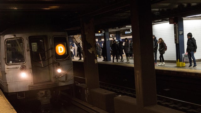People wait for the subway at Broadway-Lafeyette Station on Jan. 28, 2015, in New York City. 