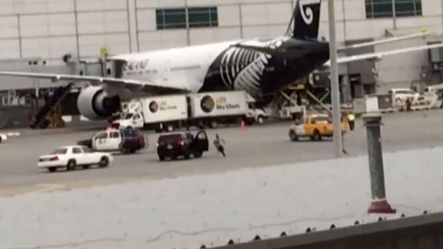 A man is seen in a secure area at San Francisco International Airport on Dec. 7, 2016, in this image capture from cell phone video obtained by CBS San Francisco station KPIX-TV. 