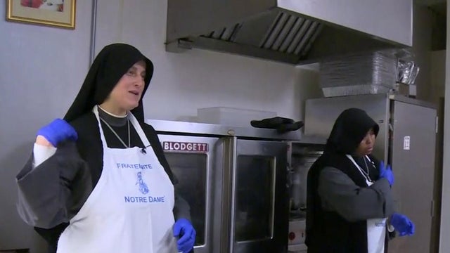 Sister Marie Benedicte, left, of the Fraternite Notre Dame prays in a story broadcast on CBS San Francisco station KPIX-TV on Dec. 14, 2016. 