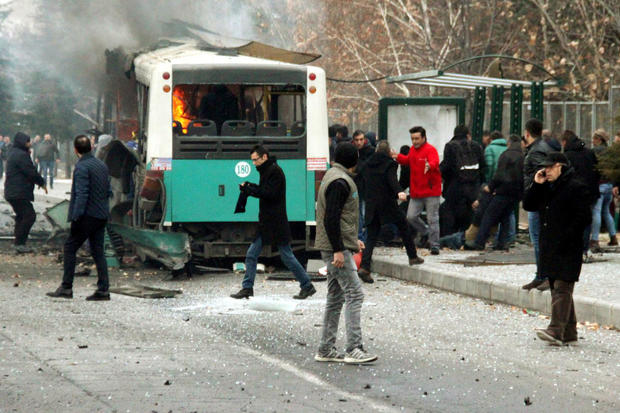 People react after a bus was hit by an explosion in Kayseri, Turkey, Dec. 17, 2016. 