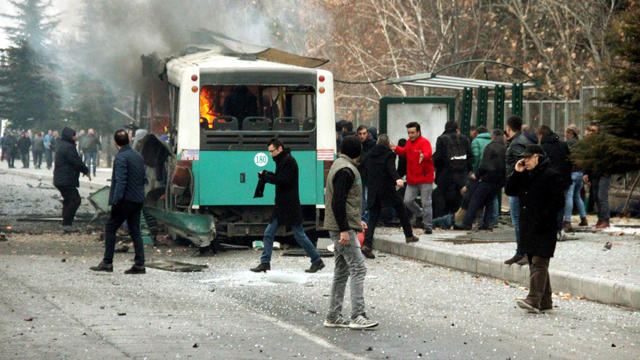 People react after a bus was hit by an explosion in Kayseri, Turkey, Dec. 17, 2016. 