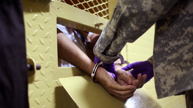 A U.S. Army guard handcuffs an Iraqi detainee on &ldquo;death row&rdquo; before taking him out for two hours of recreation at the Camp Cropper detention center Sept. 20, 2007, in Baghdad, Iraq. 