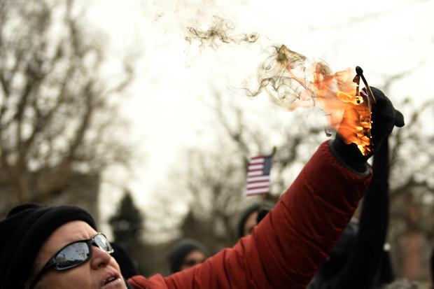 Trump protest burning small flag 