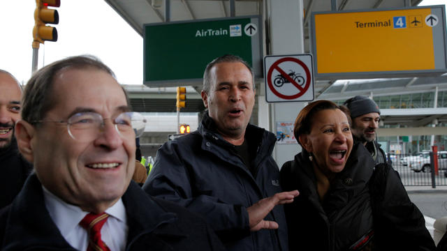 Iraqi immigrant Hameed Darweesh, center, walks out of Terminal 4 with U.S. Rep. Jerrold Nadler and U.S. Rep. Nydia Velazquez after being released at John F. Kennedy International Airport in Queens, New York, Jan. 28, 2017. 