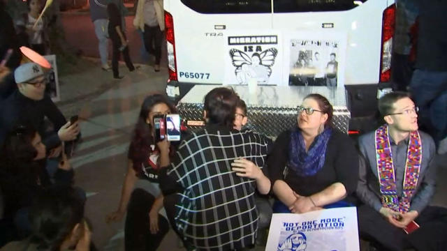 Protesters block an Immigration and Customs Enforcement van in Phoenix on the night of Feb. 8, 2017. 