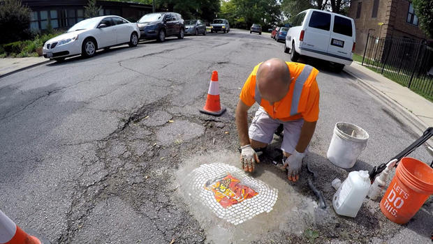 jim-bachor-working-on-pothole-mosaic-b-620.jpg 