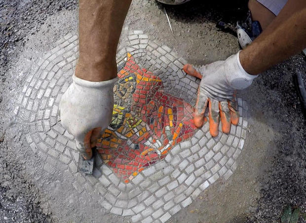 jim-bachor-working-on-pothole-mosaic-a-promo.jpg 