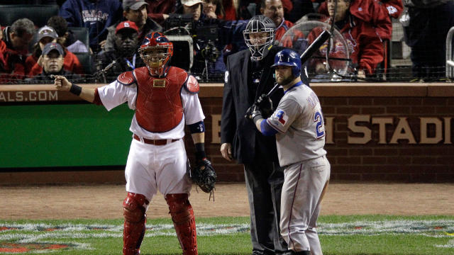 Yadier Molina, No. 4 of the St. Louis Cardinals, calls for the intentional walk on Mike Napoli, No. 25 of the Texas Rangers, in the fifth inning during Game Six of the MLB World Series at Busch Stadium on Oct. 27, 2011, in St Louis, Missouri. 