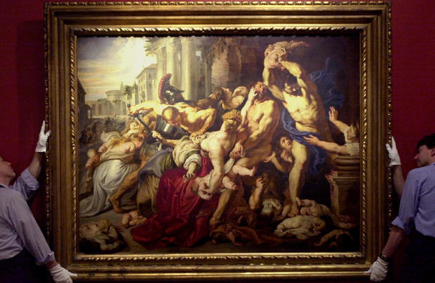 Sotheby’s staff display “The Massacre of the Innocents” by Sir Peter Paul Rubens (1577-1640), painted between 1609 and 1611, at Sotheby’s in London July 5, 2002. 