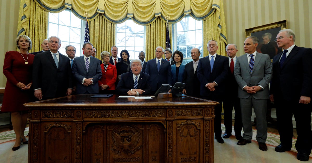 Trump signs executive order to cut costs of federal government - CBS News