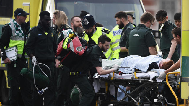 A member of the public is loaded into an ambulance by emergency services workers near Westminster Bridge and the Houses of Parliament on March 22, 2017, in London, England. 