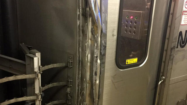 Damage to a New Jersey Transit train is seen after it was clipped by an Amtrak train at New York’s Penn Station on March 24, 2017. 