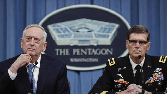 Defense Secretary Jim Mattis, left, and Gen. Joseph Votel listen to questions during a news conference at the Pentagon, April 11, 2017. 