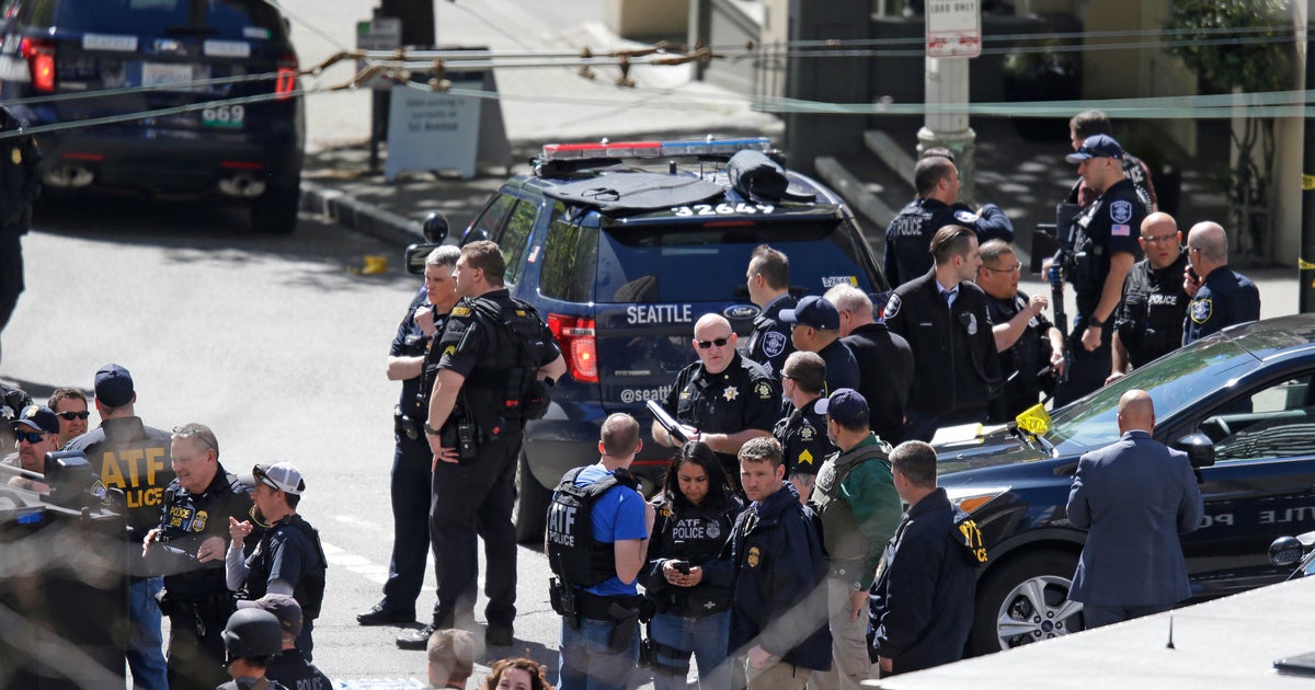 Seattle police officers shot while responding to robbery - CBS News