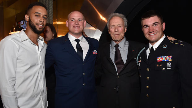 (L-R) Honorees Anthony Sadler and Airman First Class Spencer Stone, actor/director Clint Eastwood, and honoree Specialist Alek Skarlatos 