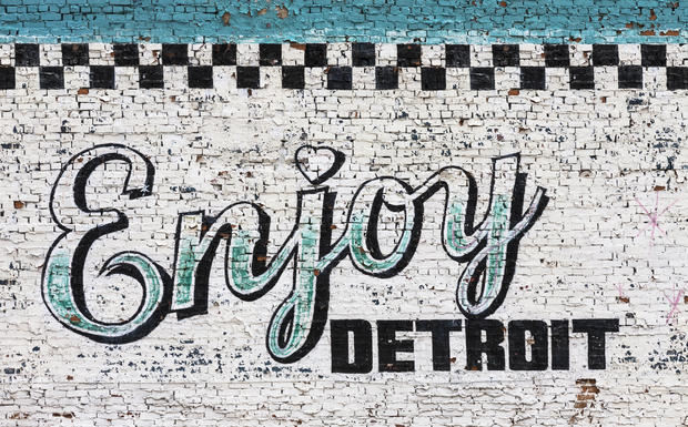 Enjoy Detroit sign on wall 