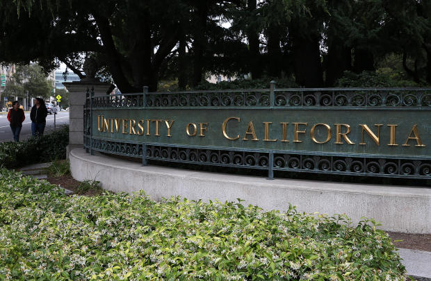 Pedestrians walk by an entrance to the University of California, Berkeley, campus on May 22, 2014, in Berkeley, California. 