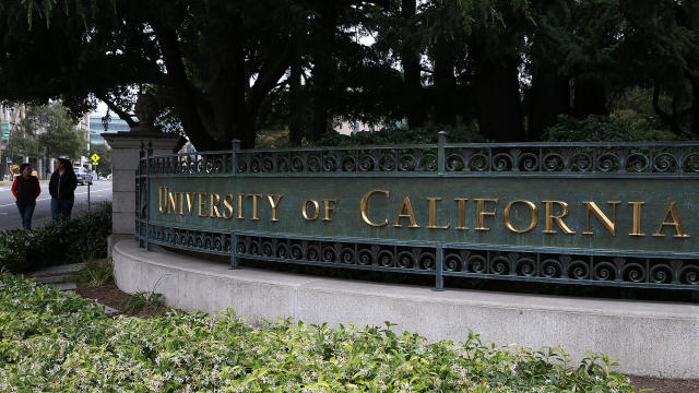 Pedestrians walk by an entrance to the University of California, Berkeley, campus on May 22, 2014, in Berkeley, California. 