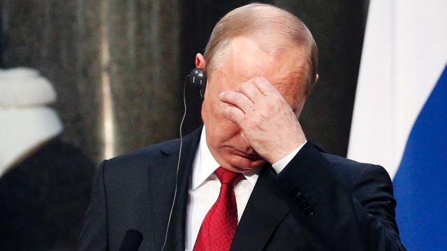 Russian President Vladimir Putin reacts during a joint press conference with French President Emmanuel Macron, not pictured, following their meeting at the Versailles Palace, near Paris, on May 29, 2017. Macron is hosting Putin in their first meeting sinc 