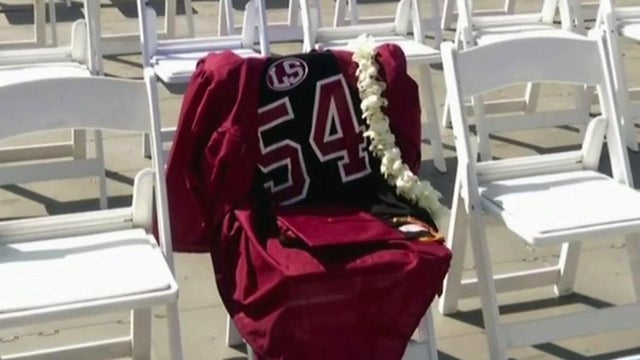 A No. 54 football jersey for Jeremy St. Julian hangs on a chair for the graduation ceremony for La Serna High School in Whittier, California, on June 7, 2017, the day after St. Julian's death. 
