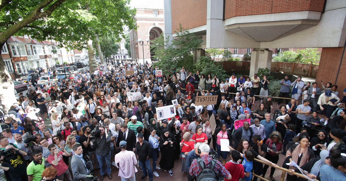 Protests in London erupt at town hall over high-rise fire - CBS News