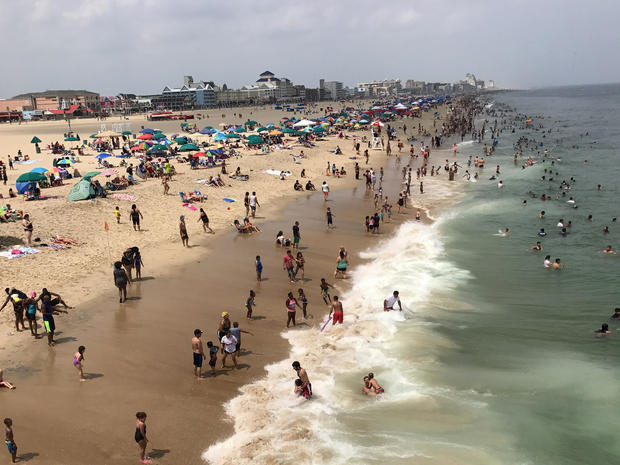 Sunbathers crowd the beach in Ocean City, Maryland, July 22, 2017. 