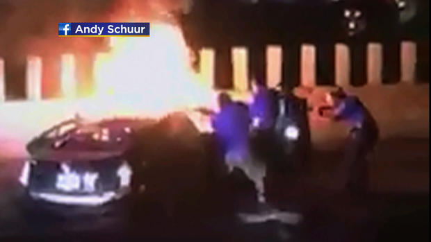 Officers and Good Samaritans Rescue Woman From Burning Car 