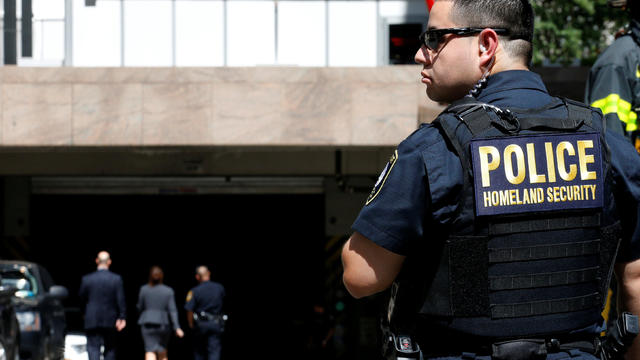 A Homeland Security officer stands in front of the parking garage of 26 Federal Plaza, following an incident where an FBI Agent was injured, in New York City, U.S. 