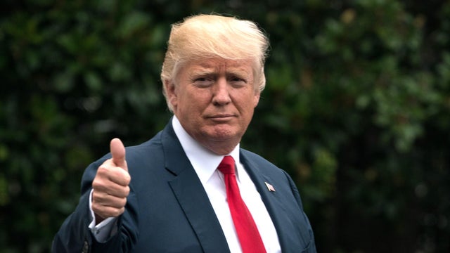 President Trump gives a thumbs-up as he departs the White House in Washington on Aug. 14, 2017, for New York. 