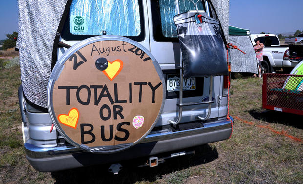 A minibus parked in a designated eclipse viewing area is seen in a campground near Guernsey 